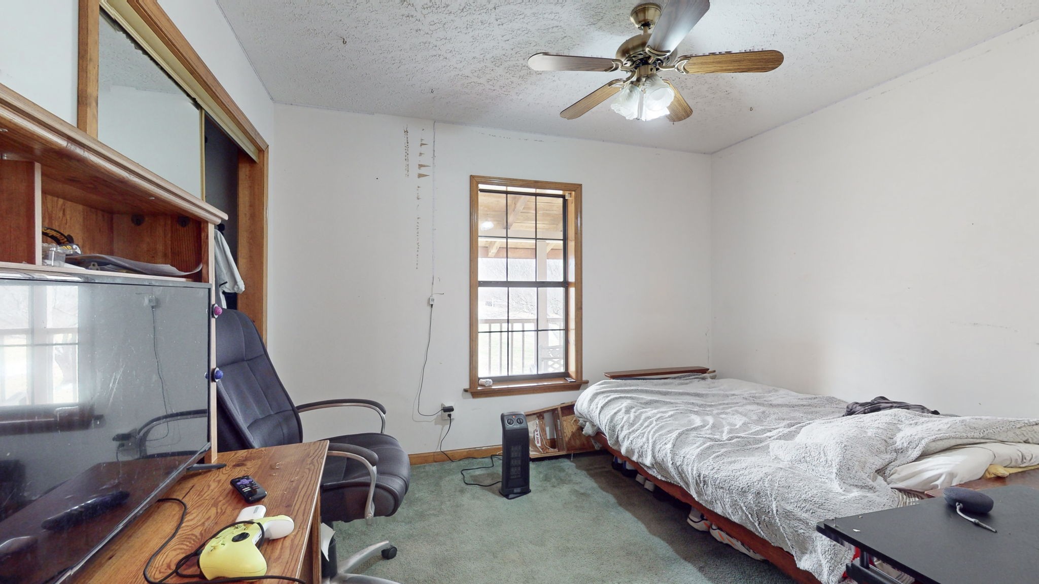 2459 Toler Road Woodlawn, TN 37191 - Photo 20 of 48 a bedroom with bed window and a chandelier