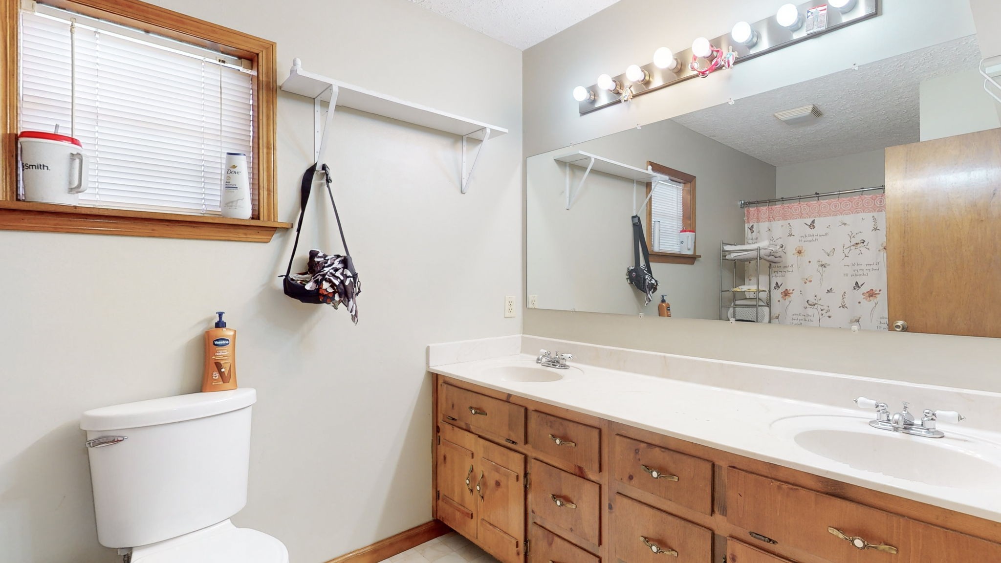 2459 Toler Road Woodlawn, TN 37191 - Photo 22 of 48 a bathroom with a sink and a mirror