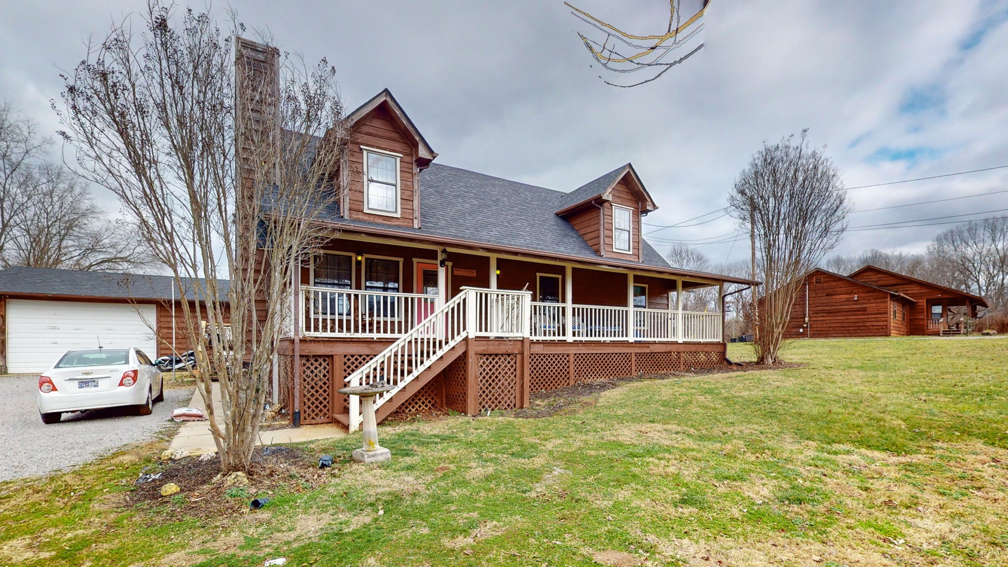 2459 Toler Road Woodlawn, TN 37191 - Photo 24 of 48 a front view of a house with a yard and garage