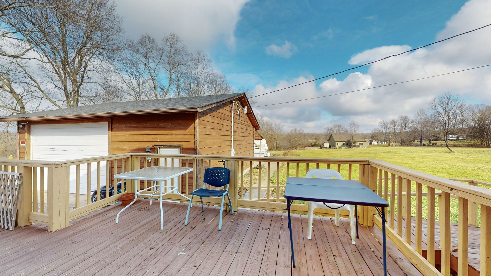 2459 Toler Road Woodlawn, TN 37191 - Photo 31 of 48 a view of a balcony with chair and wooden floor