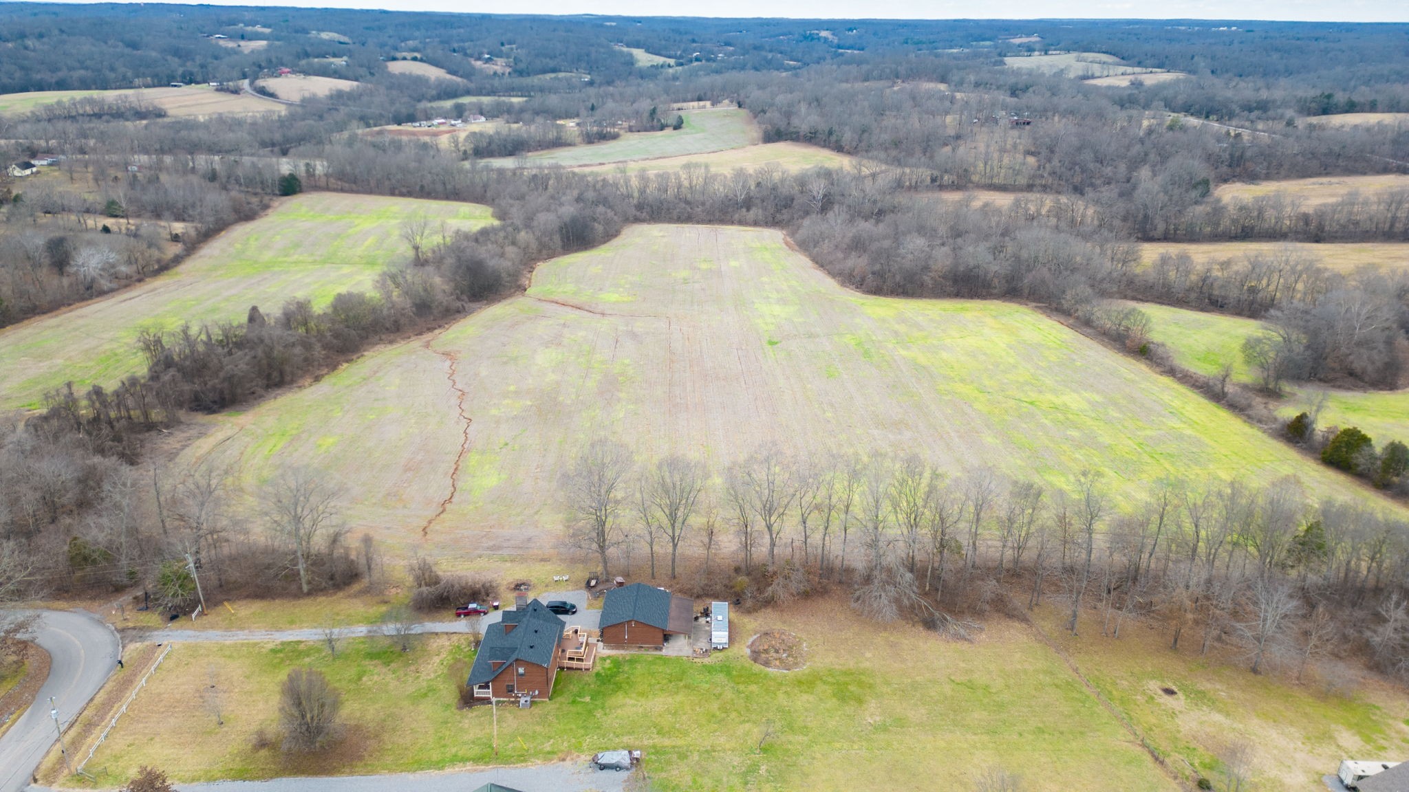 2459 Toler Road Woodlawn, TN 37191 - Photo 33 of 48 a view of a swimming pool with a yard