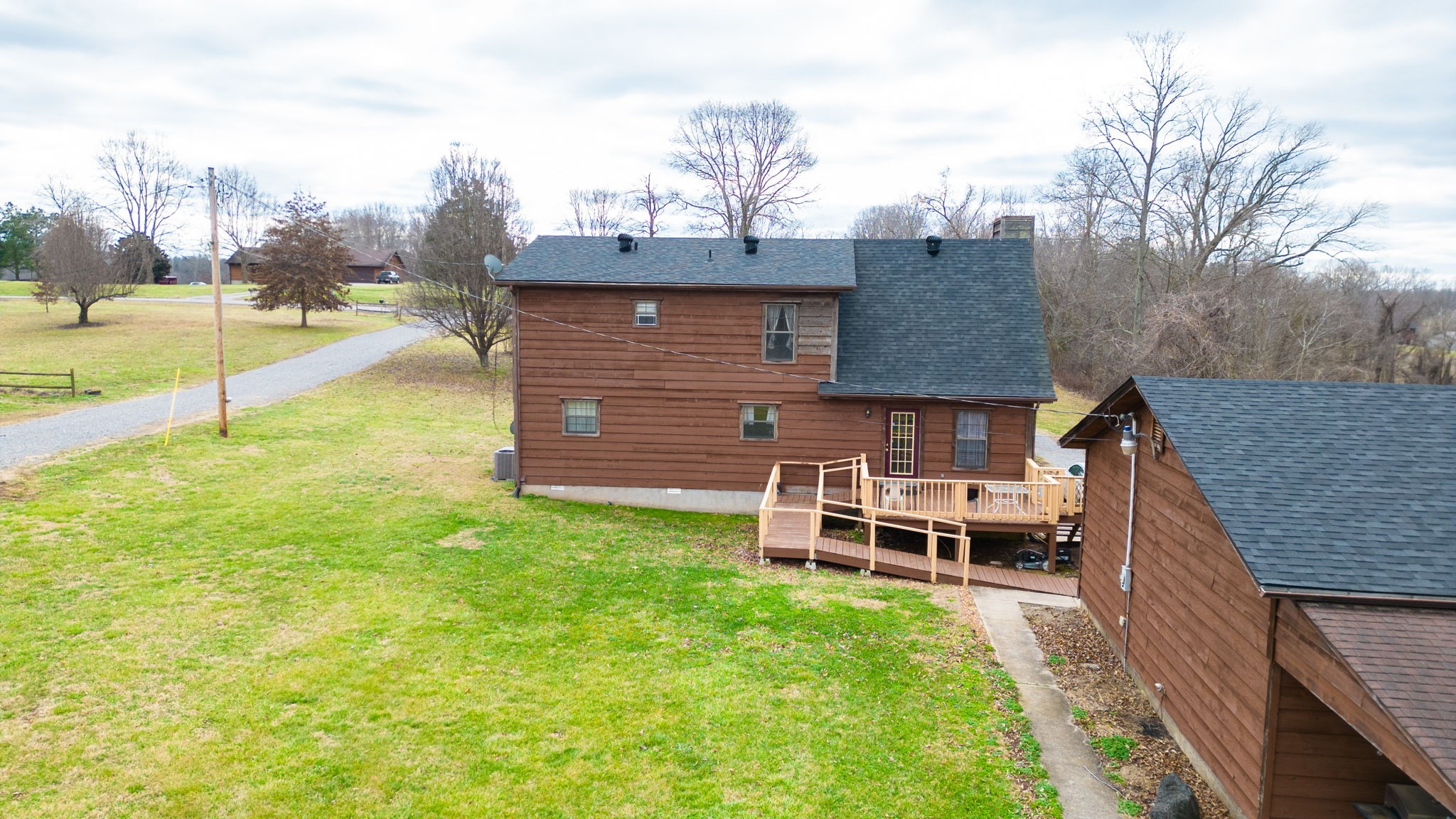 2459 Toler Road Woodlawn, TN 37191 - Photo 41 of 48 a view of a house with backyard and a chair