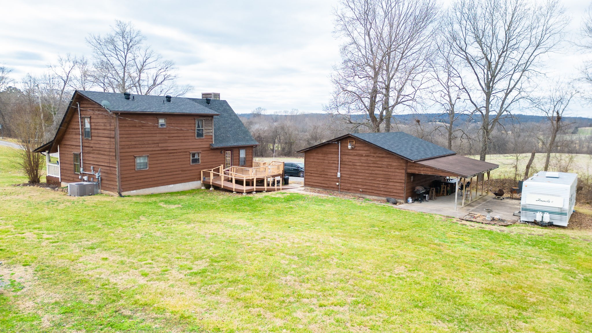 2459 Toler Road Woodlawn, TN 37191 - Photo 43 of 48 a front view of a house with garden