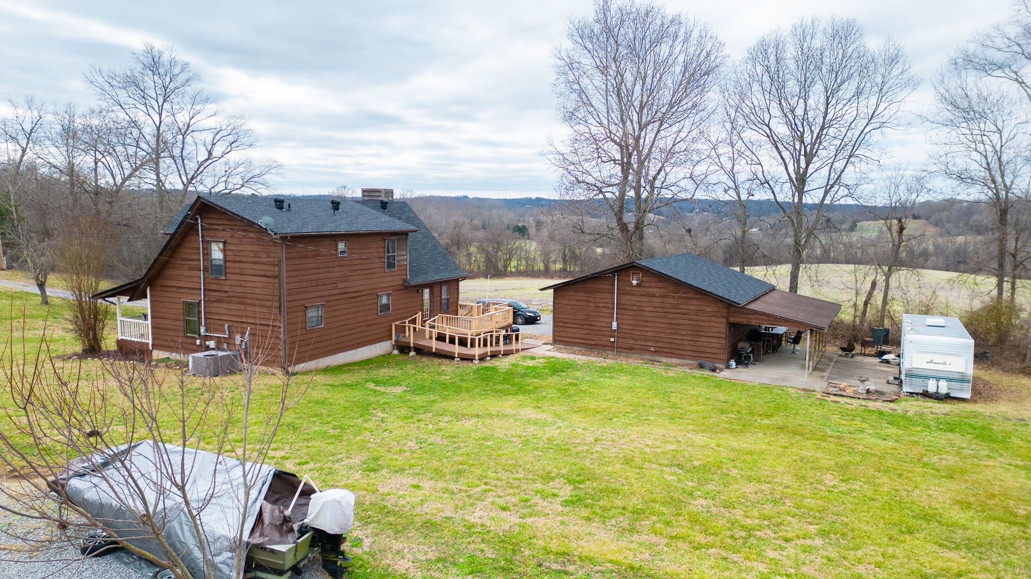 2459 Toler Road Woodlawn, TN 37191 - Photo 45 of 48 a view of a chair and table in backyard of the house