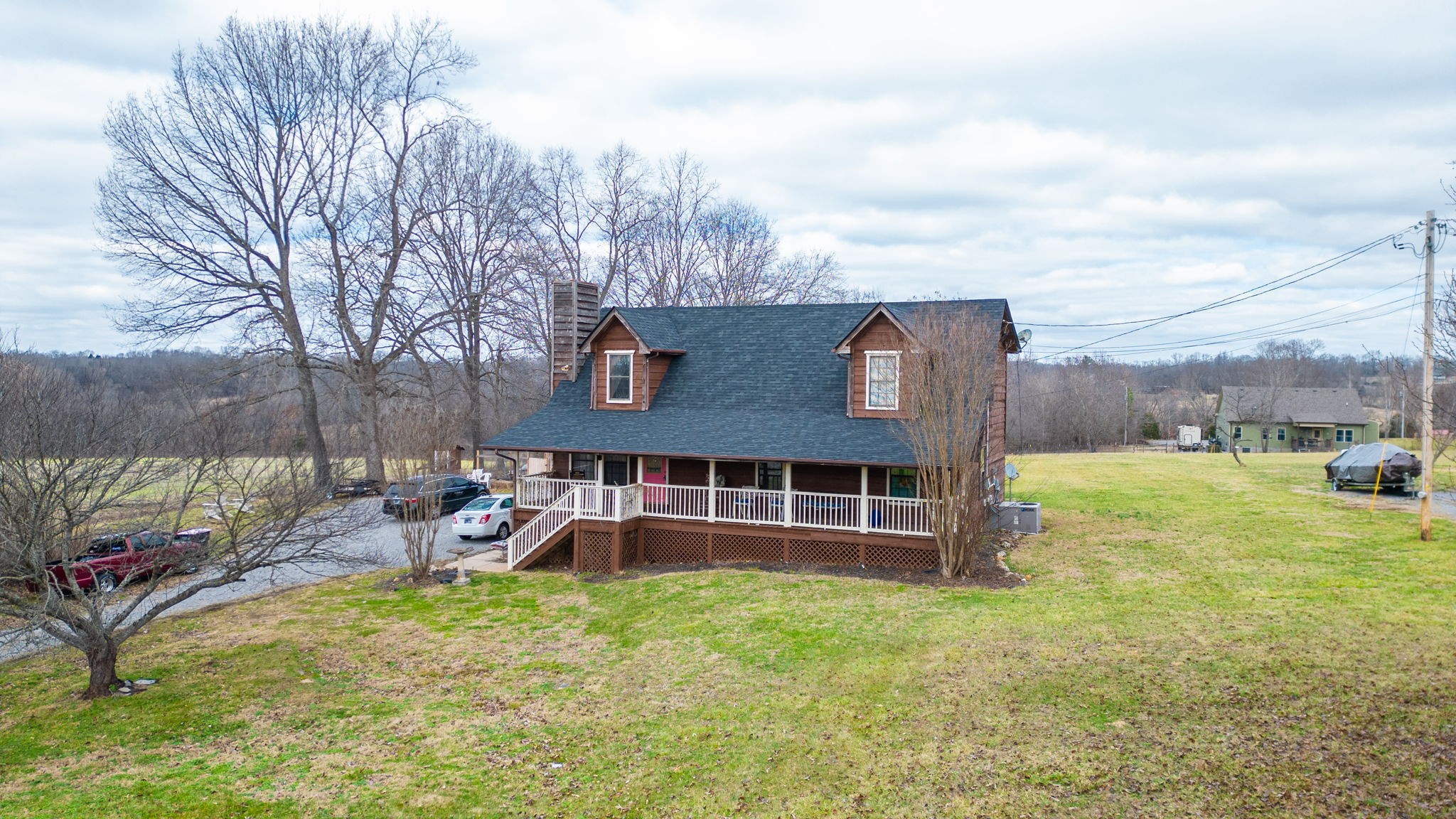 2459 Toler Road Woodlawn, TN 37191 - Photo 46 of 48 a view of a house with a yard and sitting area