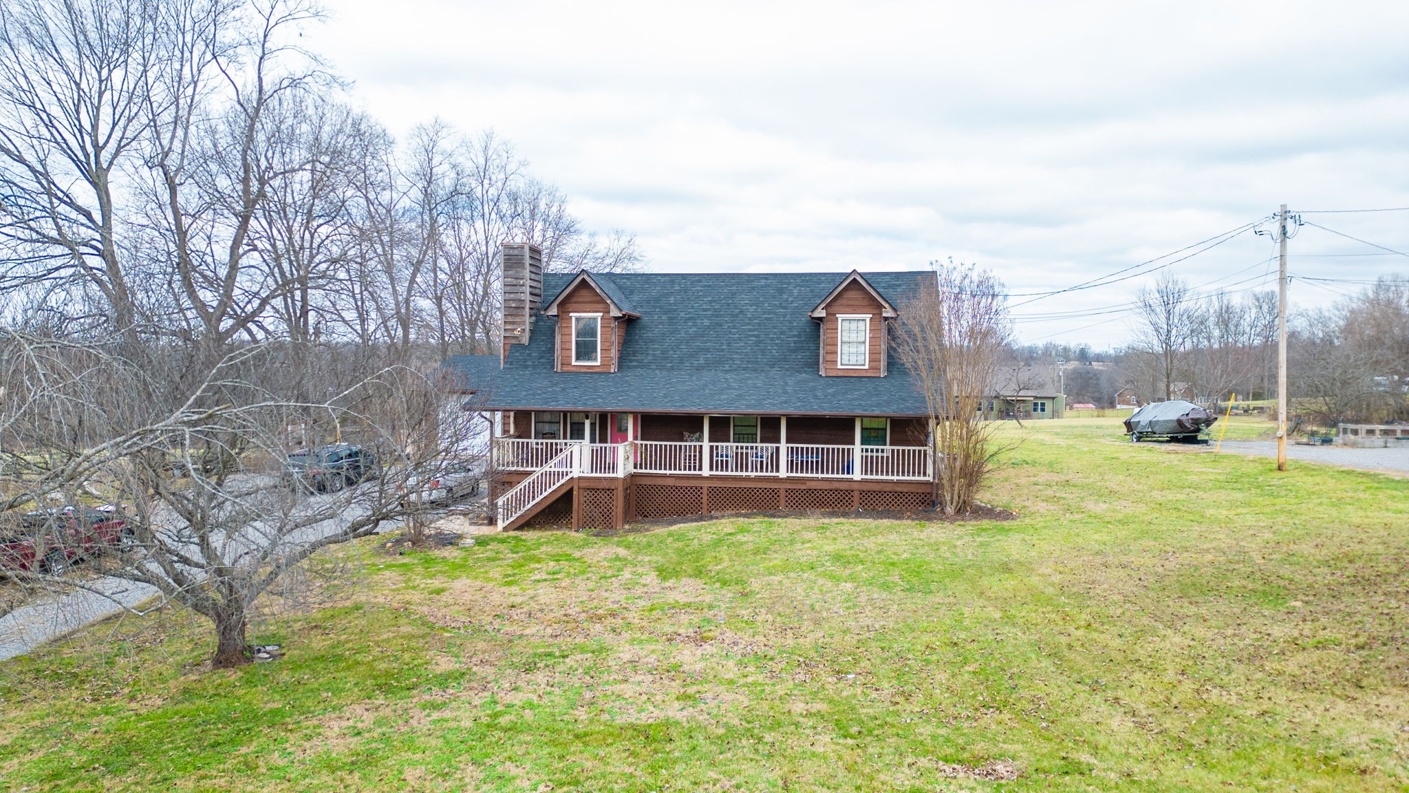2459 Toler Road Woodlawn, TN 37191 - Photo 47 of 48 a view of a house with a yard and sitting area