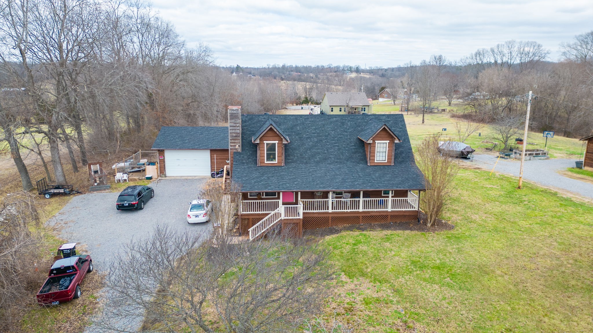 2459 Toler Road Woodlawn, TN 37191 - Photo 48 of 48 an aerial view of a house with garden space and car parked