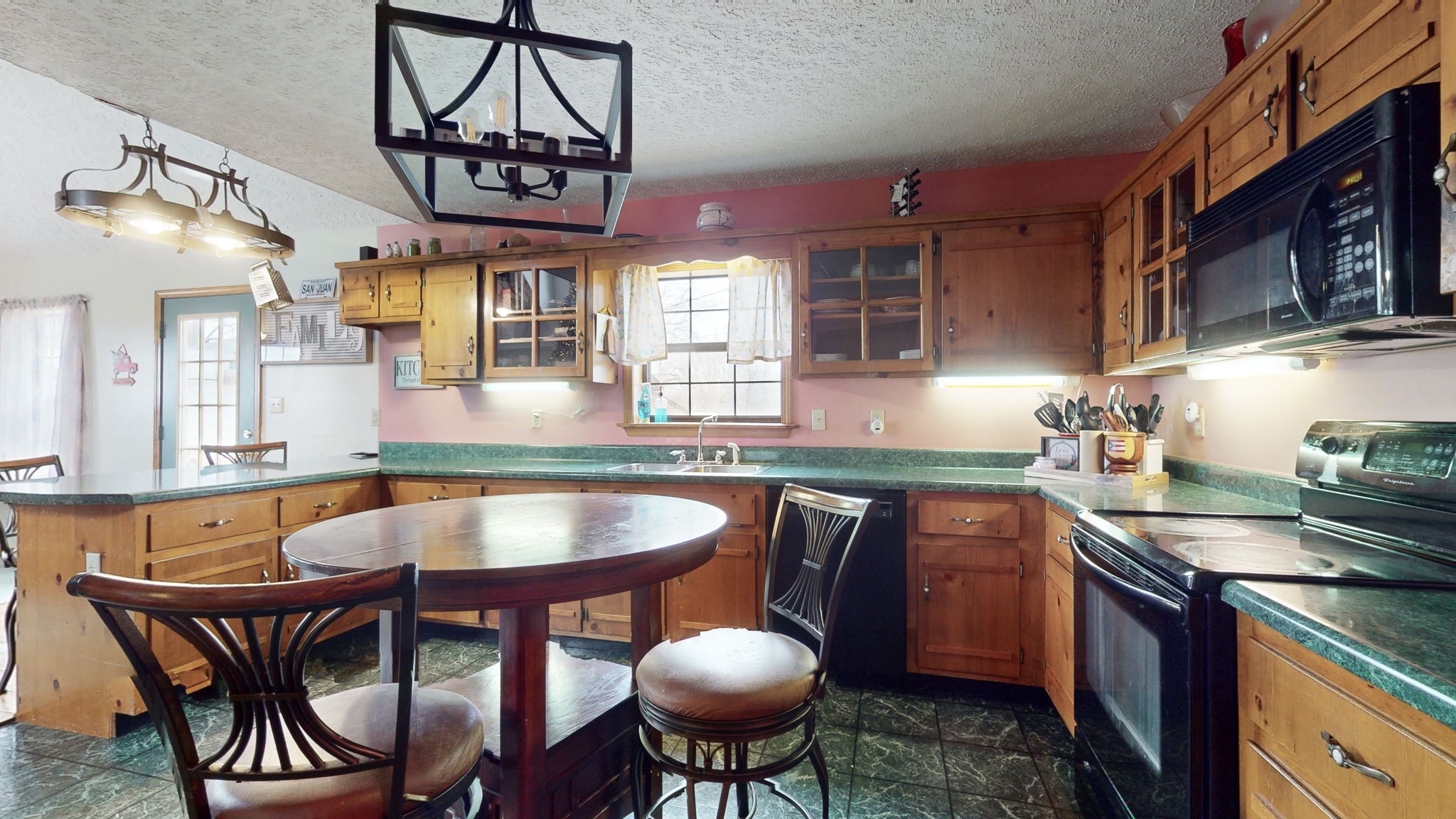 2459 Toler Road Woodlawn, TN 37191 - Photo 8 of 48 a kitchen with stainless steel appliances a dining table and chairs