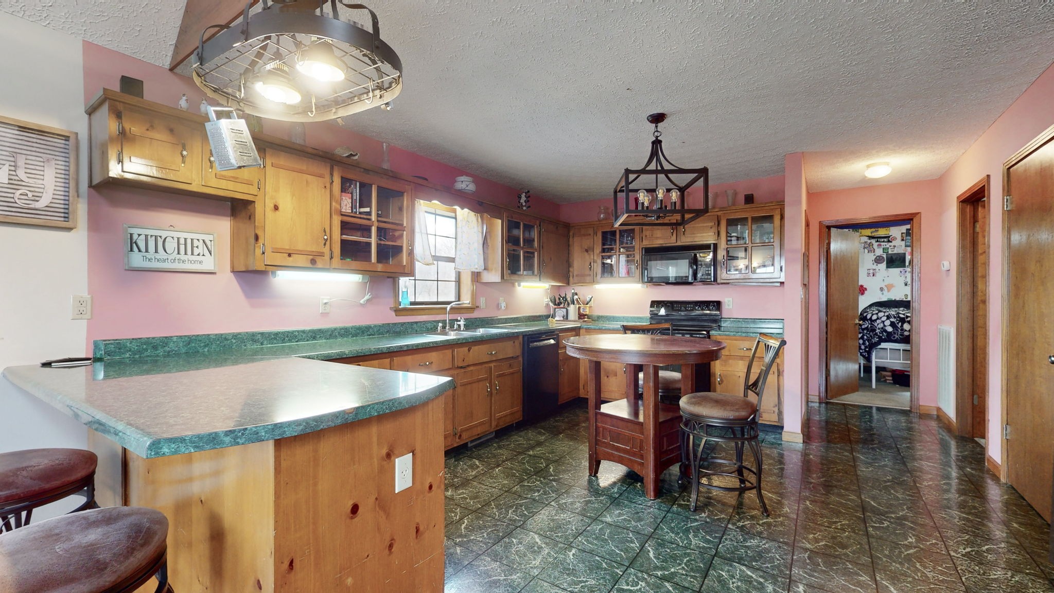 2459 Toler Road Woodlawn, TN 37191 - Photo 9 of 48 a kitchen with stainless steel appliances granite countertop a sink and a refrigerator