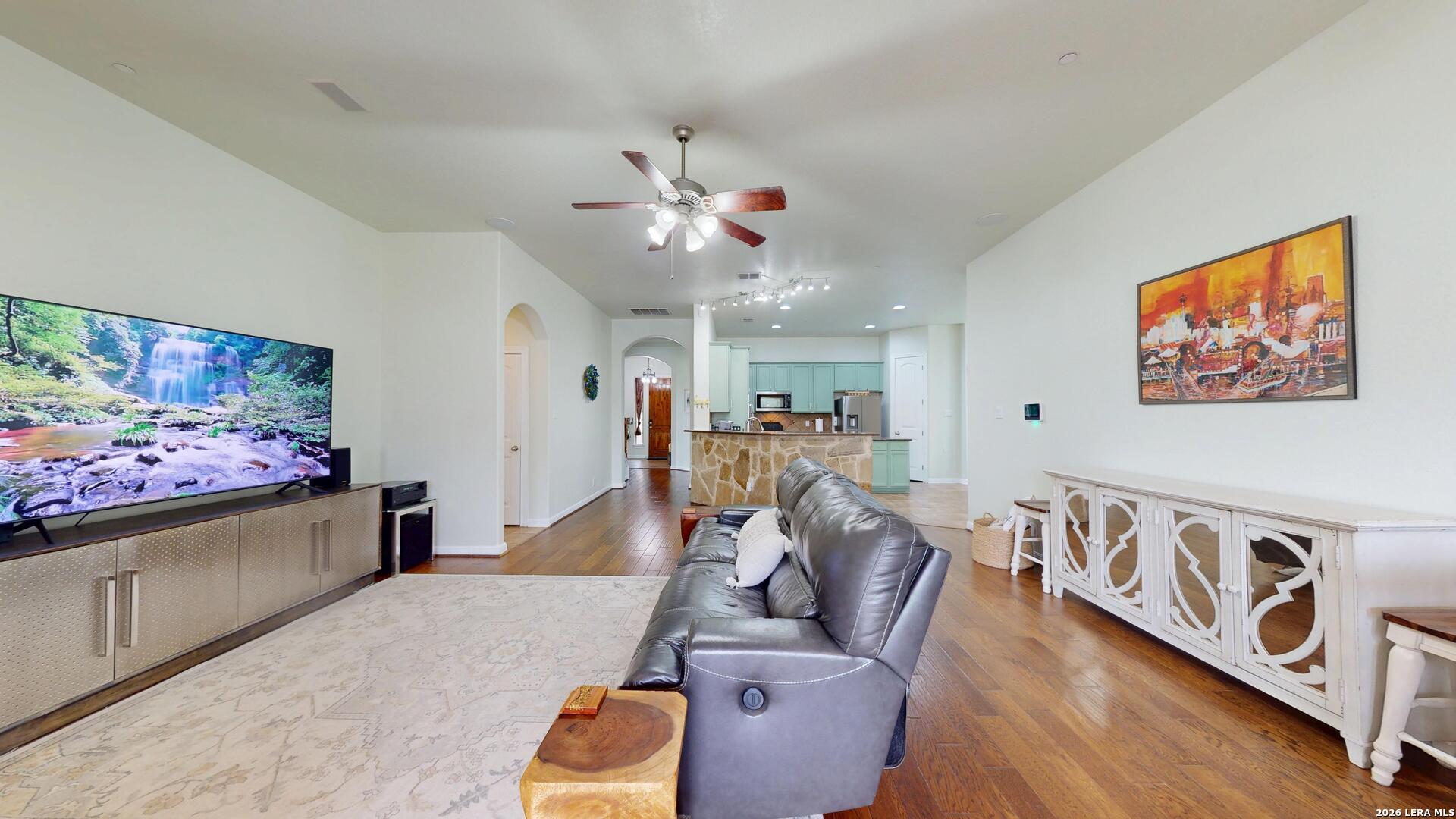 10111 Shallow Bank Converse, TX 78109 - Photo 27 of 65 a living room with furniture and a flat screen tv