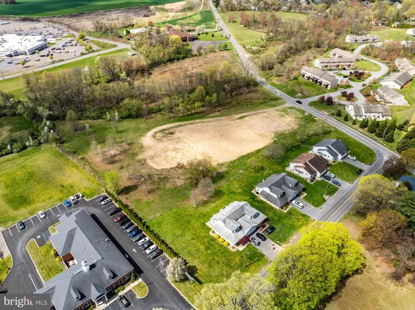 an aerial view of a house with a lake view