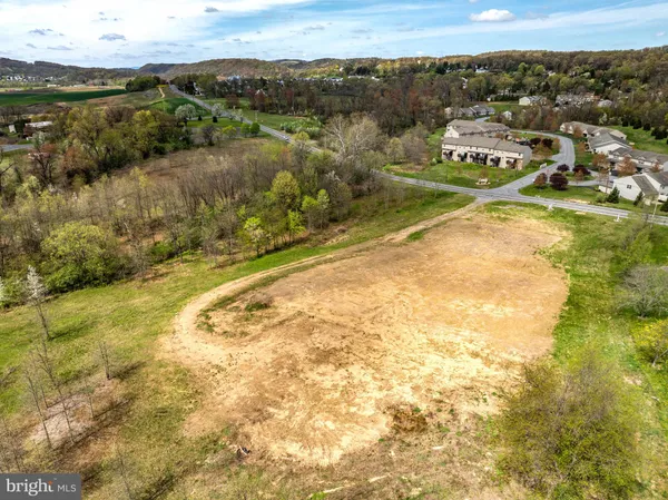 a view of a lake with a yard