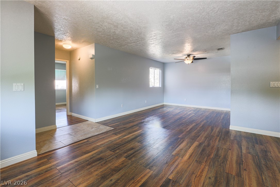 6750 Del Rey Avenue, Unit 267 Las Vegas, NV 89146 - Photo 2 of 20 Rich hardwood-style flooring flows throughout this adaptable living space.