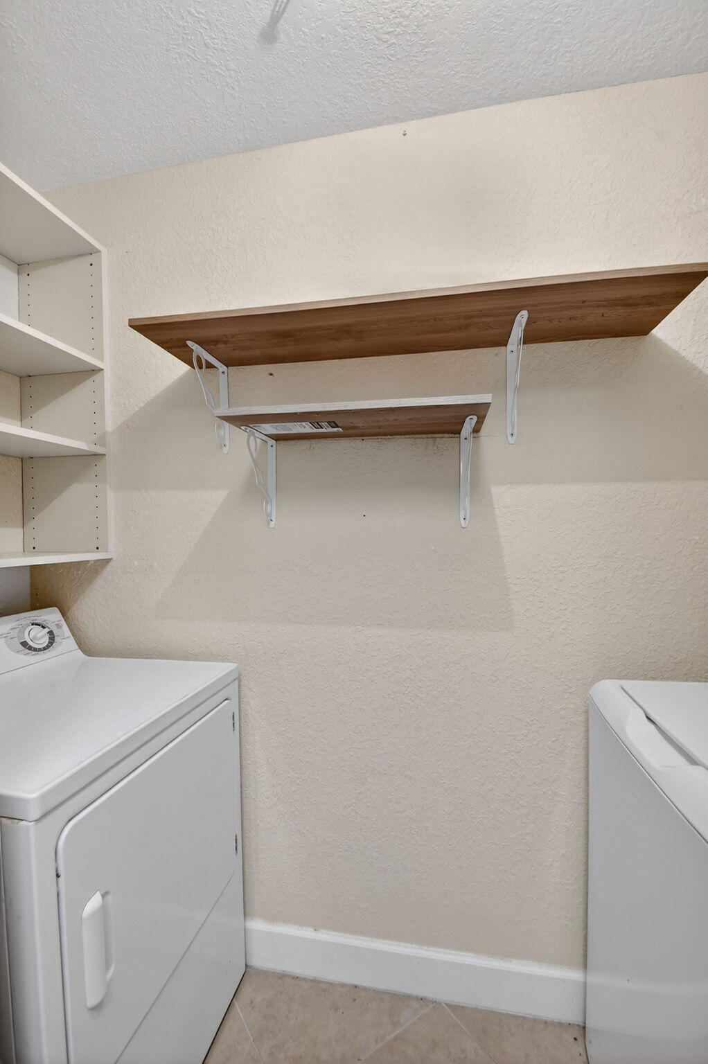 1660 Renaissance Commons Boulevard, Unit 2627 Boynton Beach, FL 33426 - Photo 17 of 32 a utility room with dryer and washer