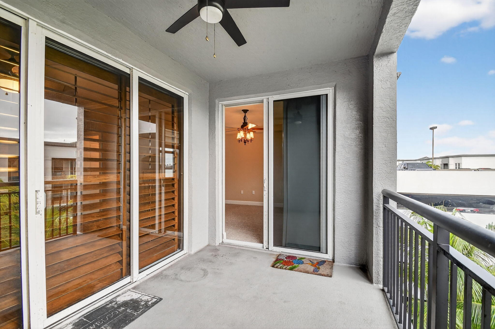 1660 Renaissance Commons Boulevard, Unit 2627 Boynton Beach, FL 33426 - Photo 18 of 32 a view of a hallway with wooden floor and windows