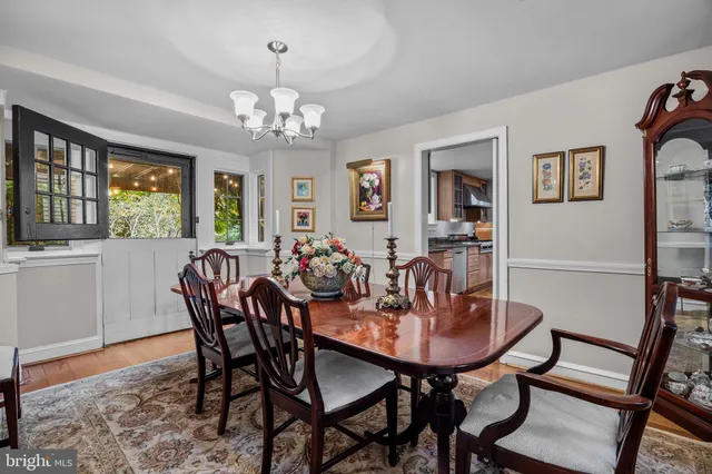 a view of a workspace with furniture and a bookshelf