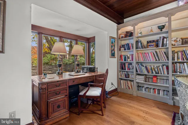 a large bed sitting in a bedroom next to a window