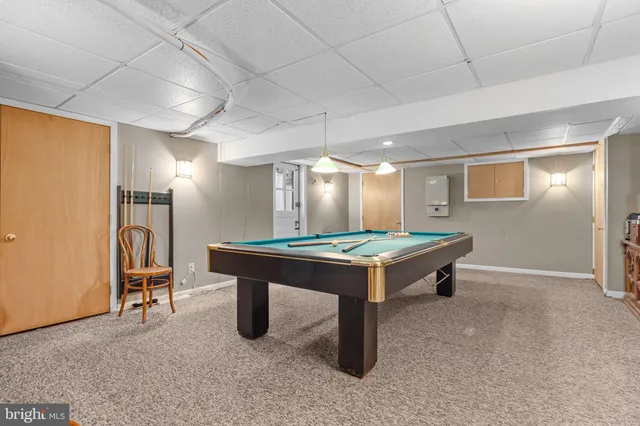 a white toilet sitting next to a bathroom sink