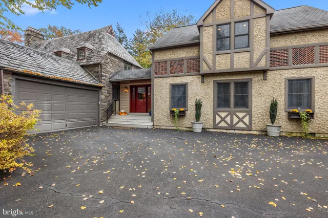 a view of an entryway with wooden floor and a livingroom