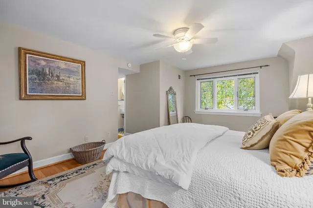 a spacious bathroom with a sink and a mirror