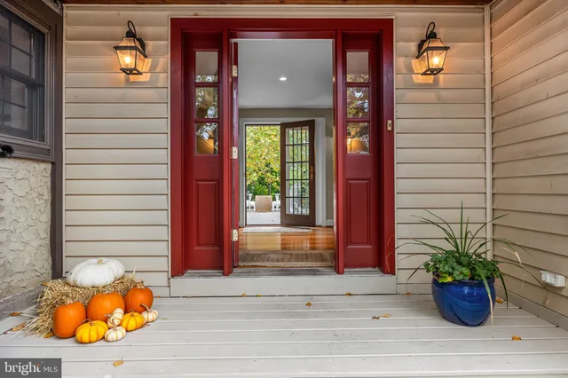 a view of a street with a building and trees