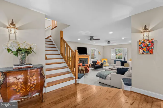 a living room with furniture fireplace and flat screen tv
