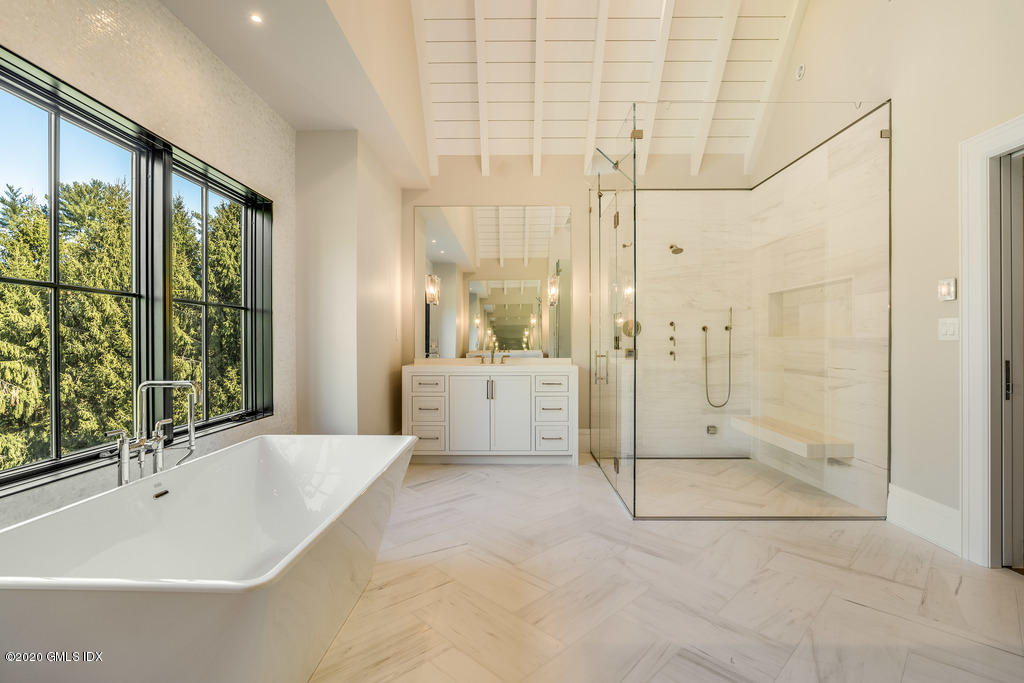 180 Stanwich Road Greenwich, CT 06830 - Photo 12 of 19 a spacious bathroom with a tub shower and view of bathroom