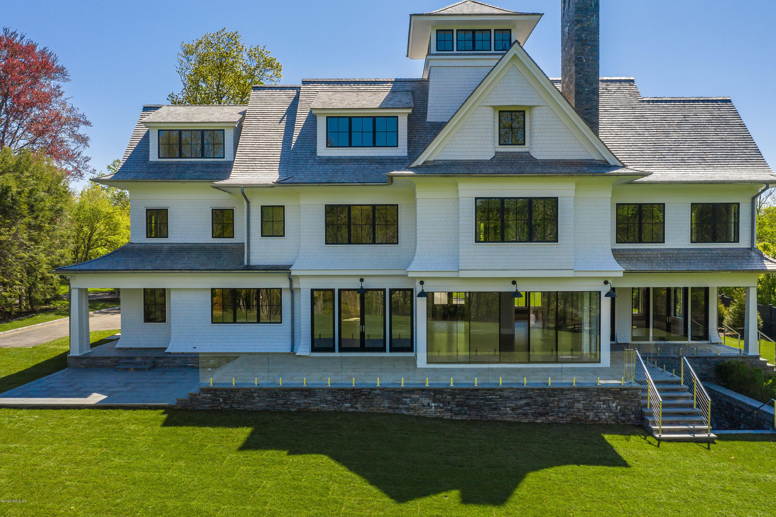 180 Stanwich Road Greenwich, CT 06830 - Photo 2 of 19 a aerial view of a house with swimming pool and porch