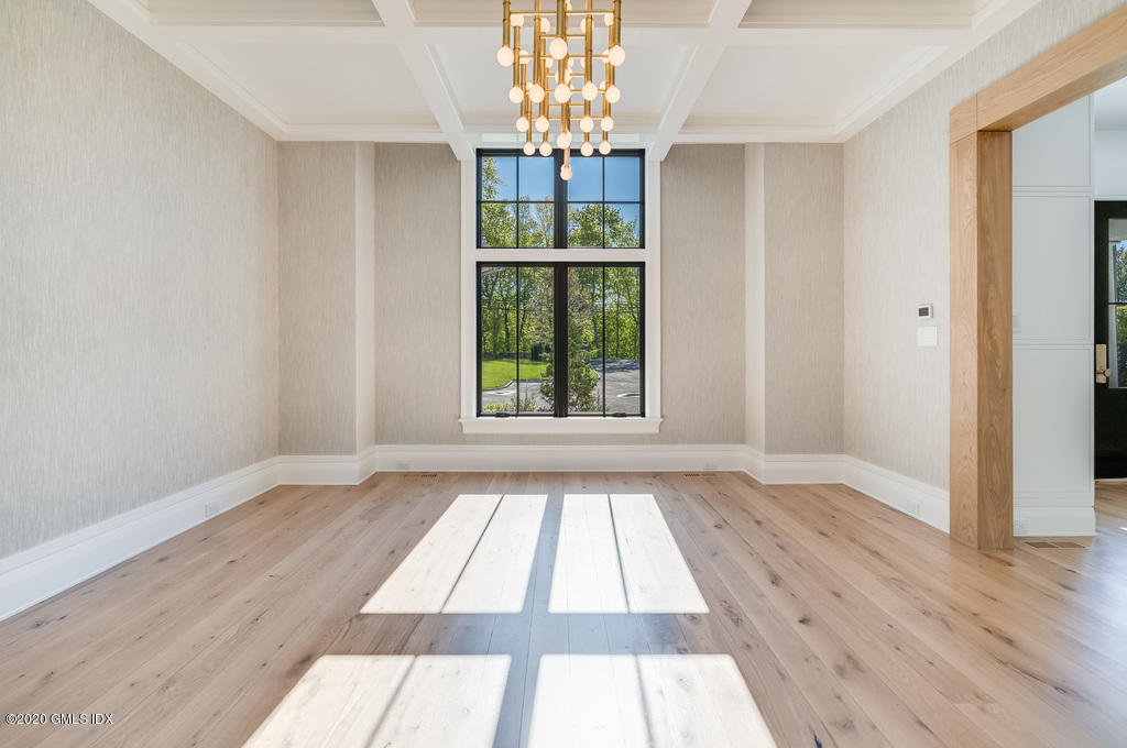 180 Stanwich Road Greenwich, CT 06830 - Photo 5 of 19 a view of an empty room with wooden floor and a window