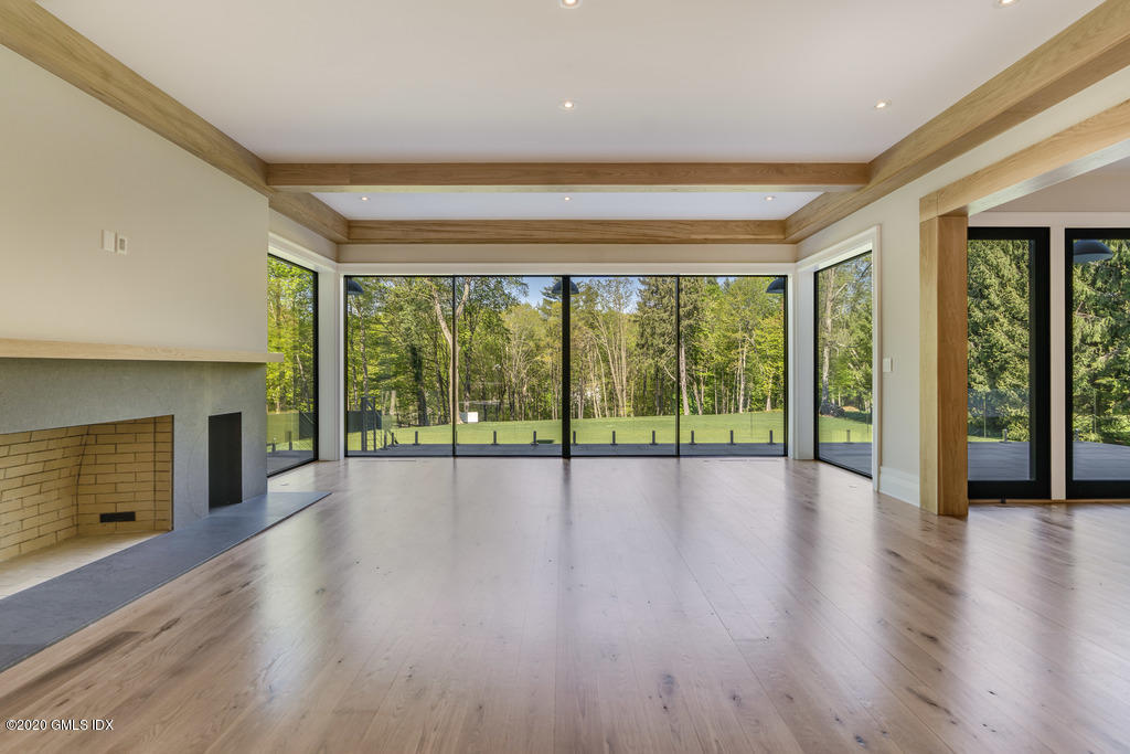 180 Stanwich Road Greenwich, CT 06830 - Photo 9 of 19 a view of an empty room with wooden floor and a window