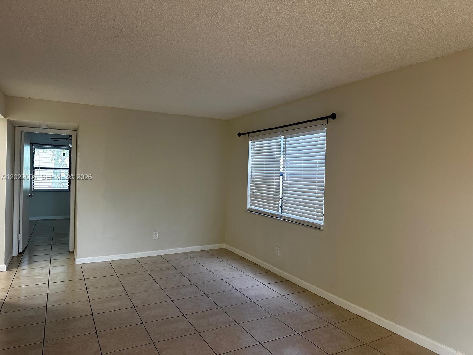 3400 Foxcroft Road, Unit 301 Miramar, FL 33025 - Photo 38 of 72 an empty room with windows