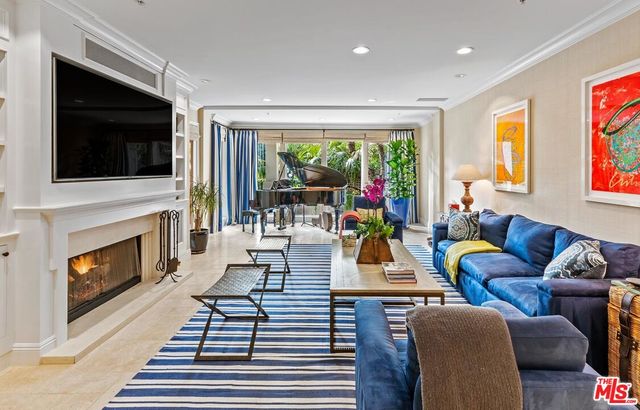 a living room with furniture fireplace and a flat screen tv