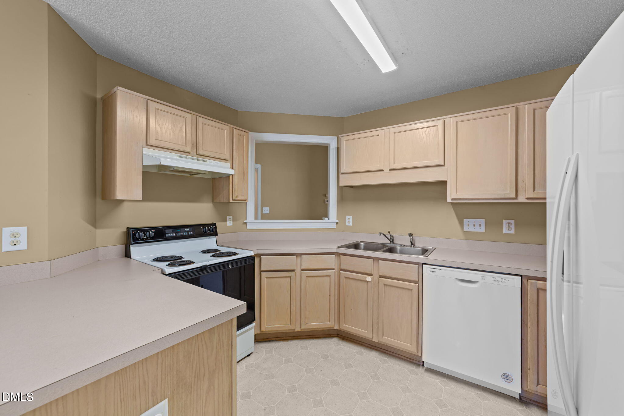 624 Harris Point Way Wake Forest, NC 27587 - Photo 12 of 38 a kitchen with white cabinets and white appliances