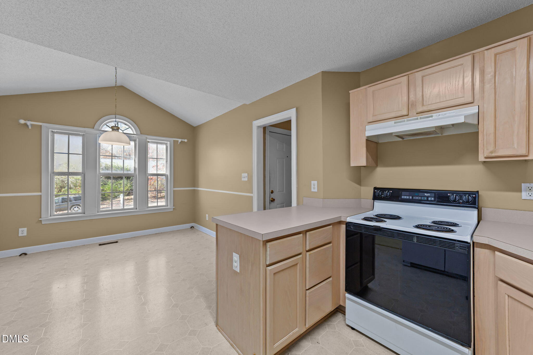 624 Harris Point Way Wake Forest, NC 27587 - Photo 13 of 38 a kitchen with a stove a sink and a microwave