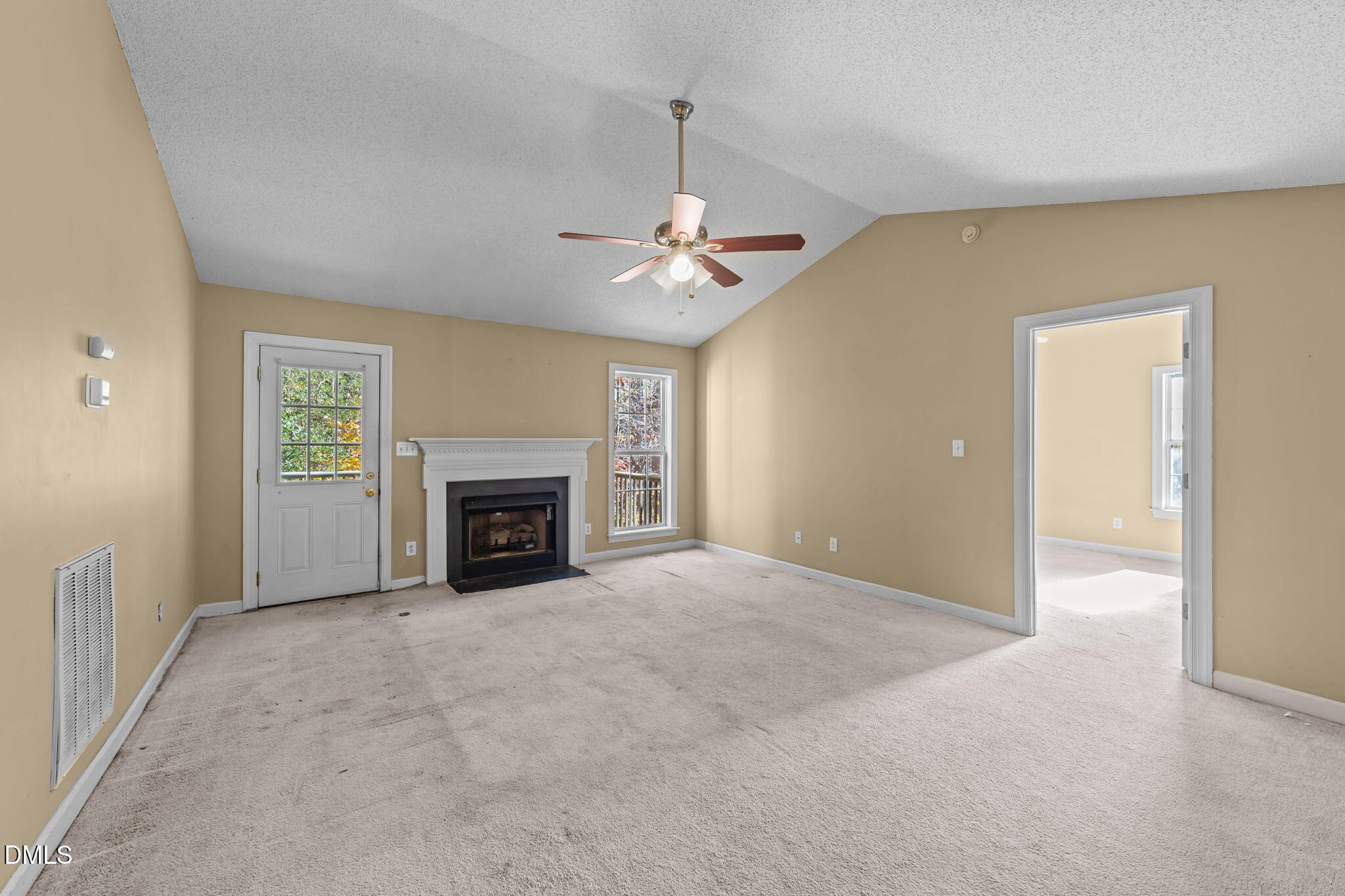 624 Harris Point Way Wake Forest, NC 27587 - Photo 16 of 38 an empty room with fireplace and windows
