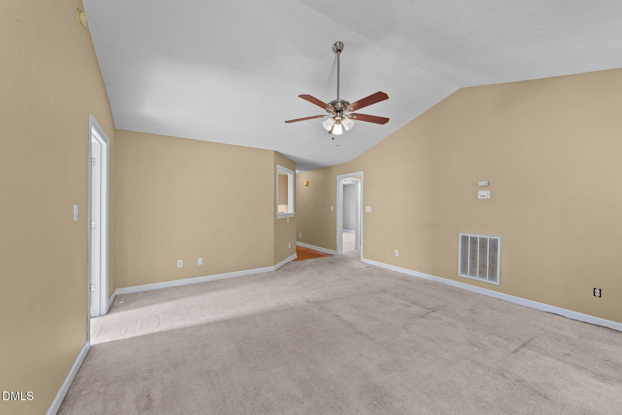 624 Harris Point Way Wake Forest, NC 27587 - Photo 18 of 38 an empty room with a ceiling fan and a window