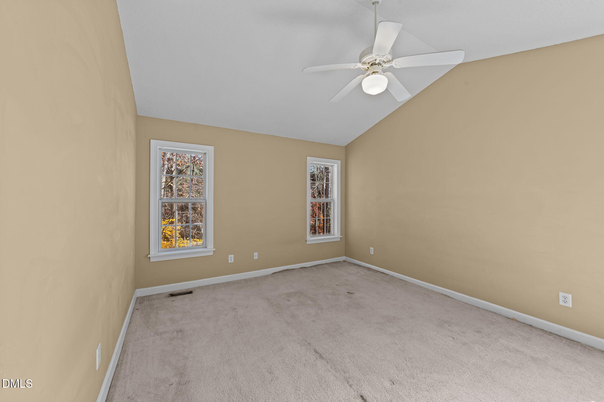 624 Harris Point Way Wake Forest, NC 27587 - Photo 20 of 38 an empty room with windows and ceiling fan