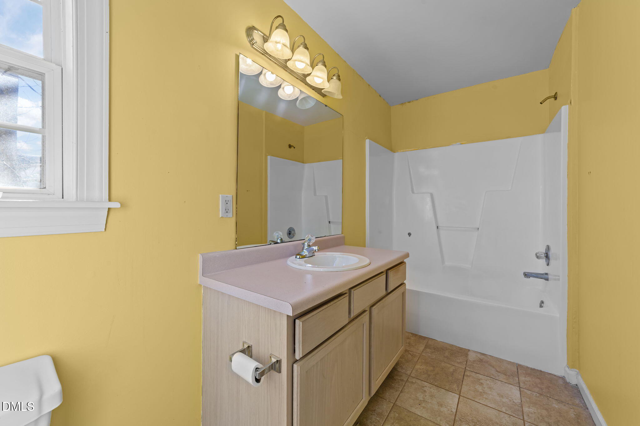 624 Harris Point Way Wake Forest, NC 27587 - Photo 22 of 38 a bathroom with a sink and a mirror