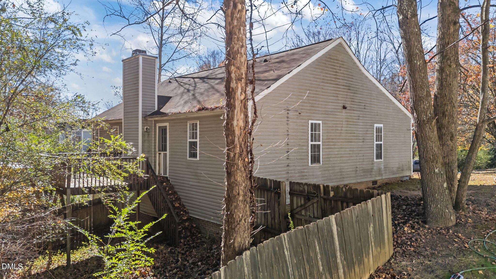 624 Harris Point Way Wake Forest, NC 27587 - Photo 34 of 38 a view of a house with wooden fence and large trees