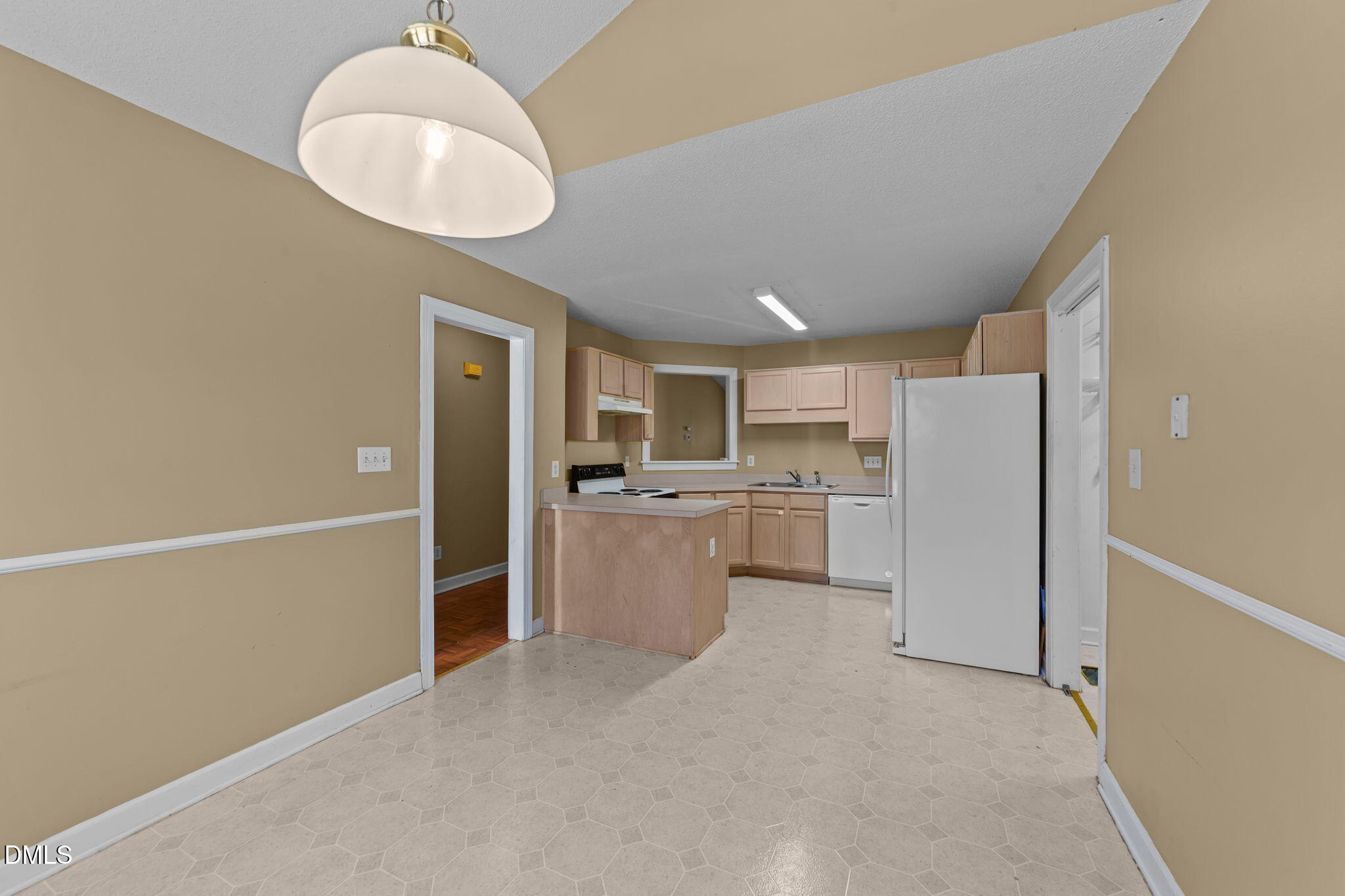 624 Harris Point Way Wake Forest, NC 27587 - Photo 10 of 38 a kitchen with a refrigerator and dishwasher