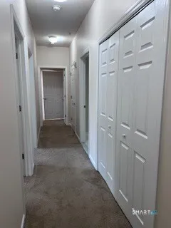 a view of an empty room and closet