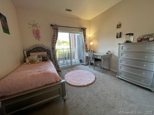 25 Adams Avenue, Unit 301 Stamford, CT 06902 - Photo 19 of 26 a bedroom with a bed and large windows
