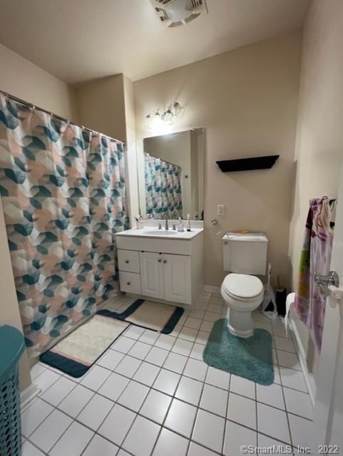 25 Adams Avenue, Unit 301 Stamford, CT 06902 - Photo 21 of 26 a bathroom with a toilet sink and shower