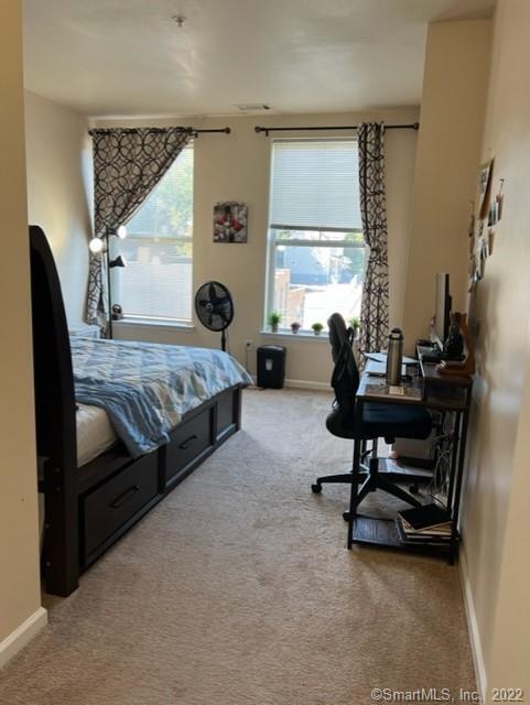 25 Adams Avenue, Unit 301 Stamford, CT 06902 - Photo 23 of 26 a bedroom with bed and a window