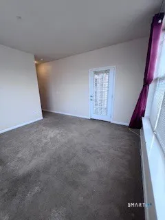 a view of a balcony with wooden floor