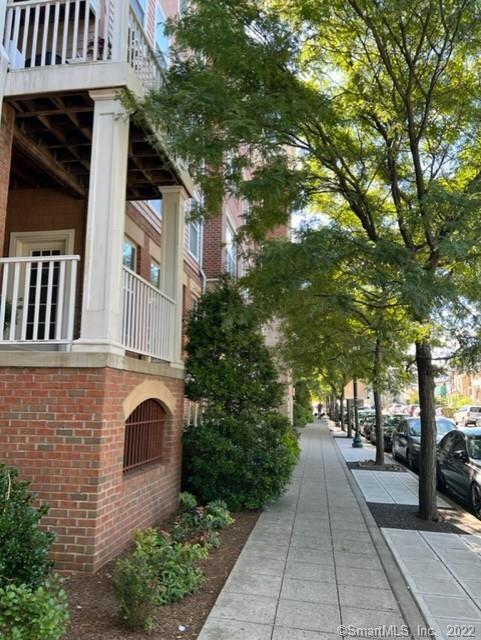 25 Adams Avenue, Unit 301 Stamford, CT 06902 - Photo 4 of 26 a front view of a house with garden
