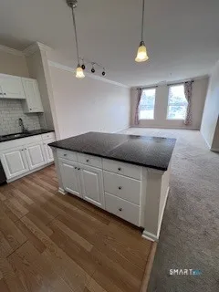 a kitchen with stainless steel appliances granite countertop a refrigerator and a stove