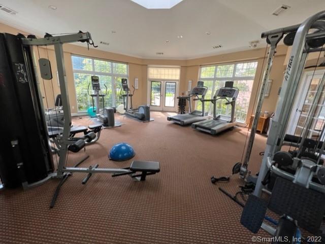25 Adams Avenue, Unit 301 Stamford, CT 06902 - Photo 8 of 26 a room with gym equipment and a large window