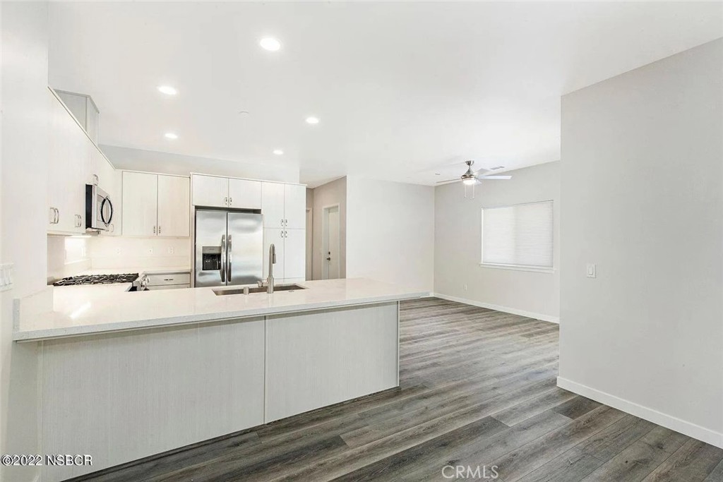 a view of kitchen with wooden floor