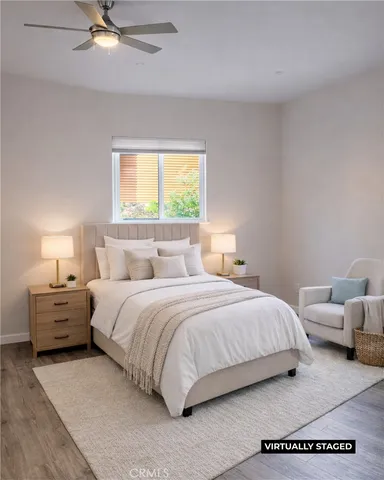 a bedroom with a bed and window